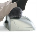 Man Using Exerciser Elite with Sheepskin Cover and small pillow.